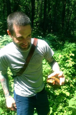 Brother Bull holds an eastern box turtle at the Schuylkill Environmental Center